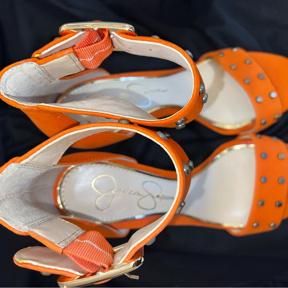 Jessica Simpson tangerine heeled sandal with gold accent.